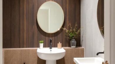 Elevate Your Powder Room: Dark Wood Accent Walls for Timeless Charm