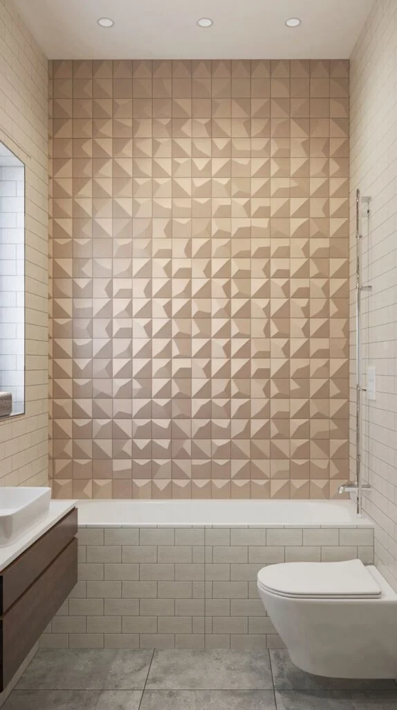 Textured luxury accent wall covering the shower area, using low-relief 3D geometric triangular tiles in soft, monochrome beige/tan tones.