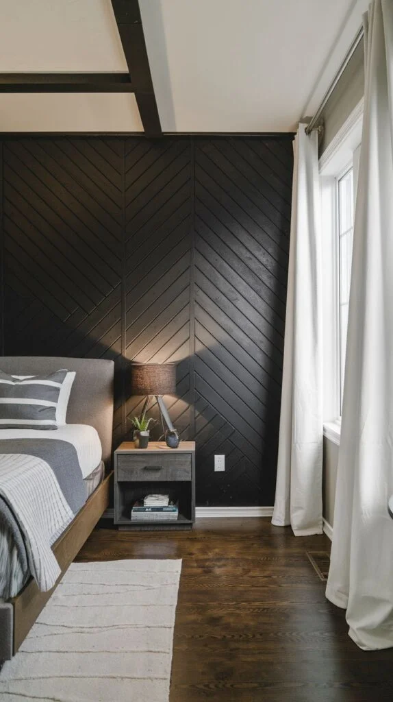 Rustic-modern bedroom with black chevron wood plank accent wall