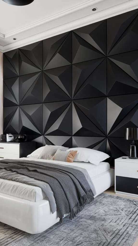 Black accent wall with large interlocking 3D geometric panels creating dramatic shadows