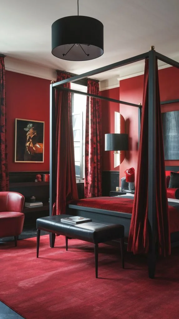 Opulent red bedroom with black four-poster bed, red velvet drapes, and red armchair.