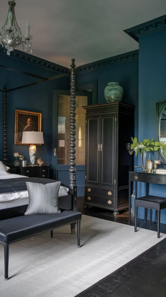 Bedroom with deep blue walls, carved black four-poster bed, vintage wardrobe, and white rug.