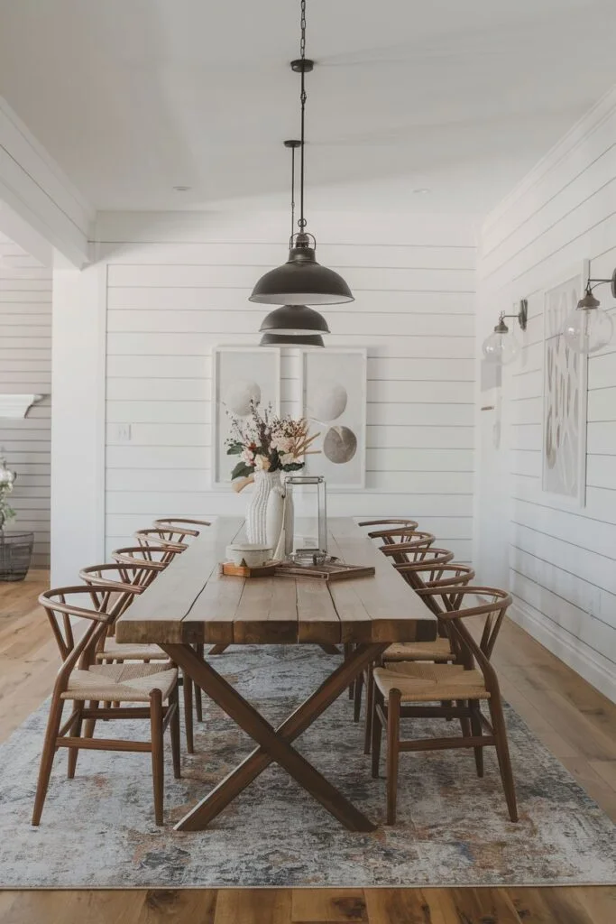 Farmhouse dining room with rustic wooden table and pendant lights