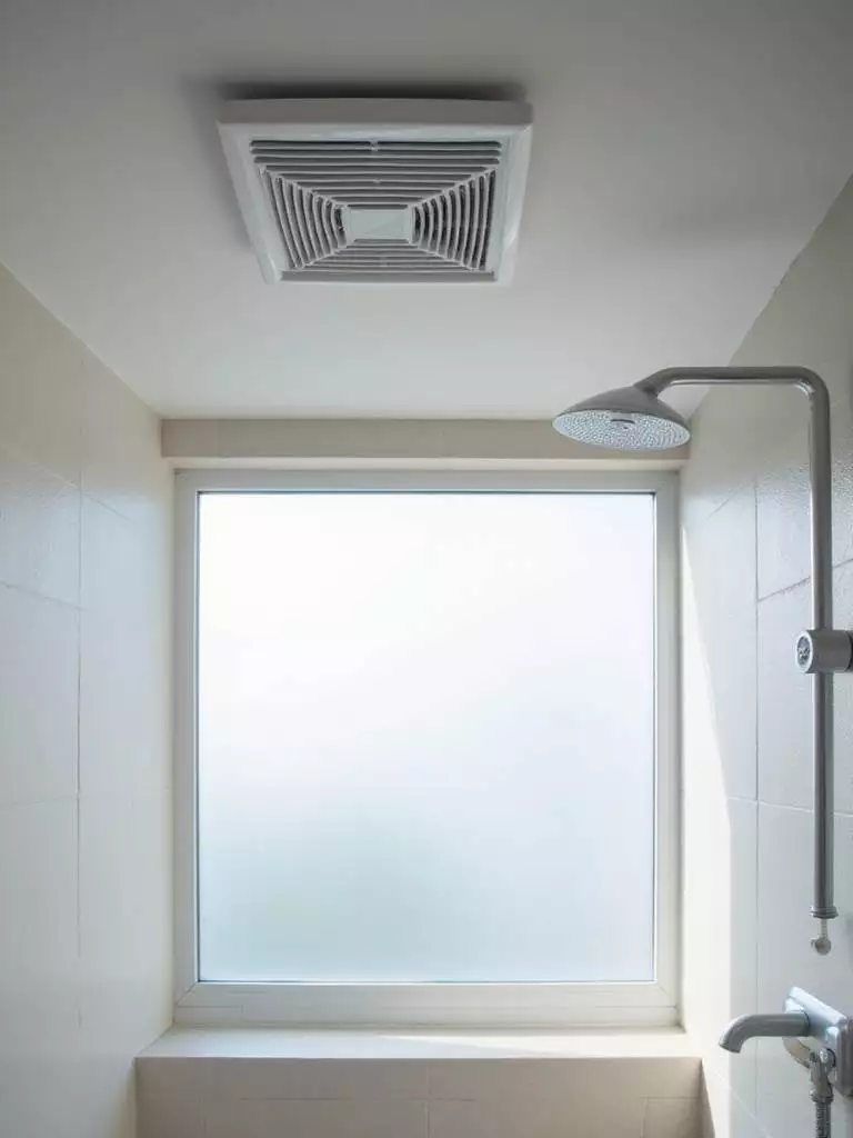 Modern bathroom with ceiling exhaust fan promoting ventilation and air quality.