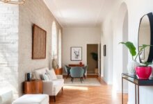 Elegant Hallways Transformed: The Timeless Charm of Herringbone Wood Floors