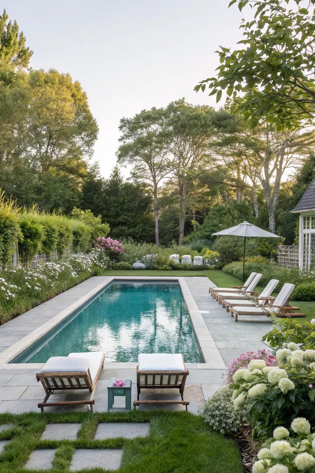 A sleek swimming pool creates a luxurious Hamptons-inspired backyard oasis.