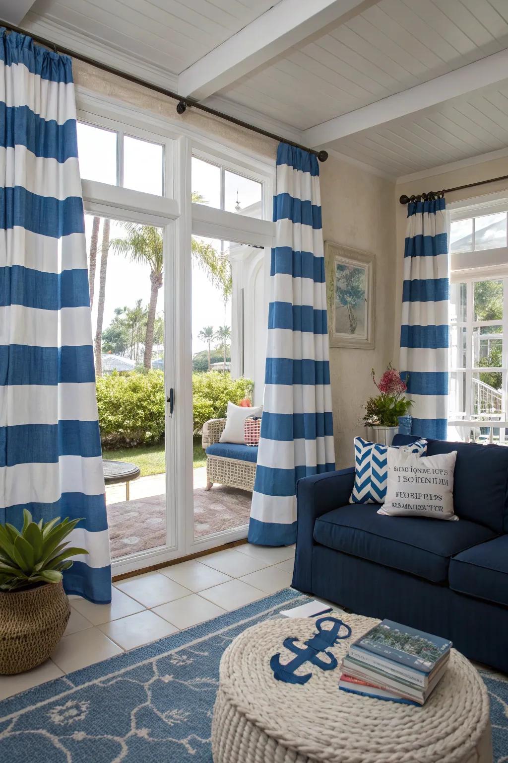 Blue striped patterns evoke a coastal vibe in this bright living room.