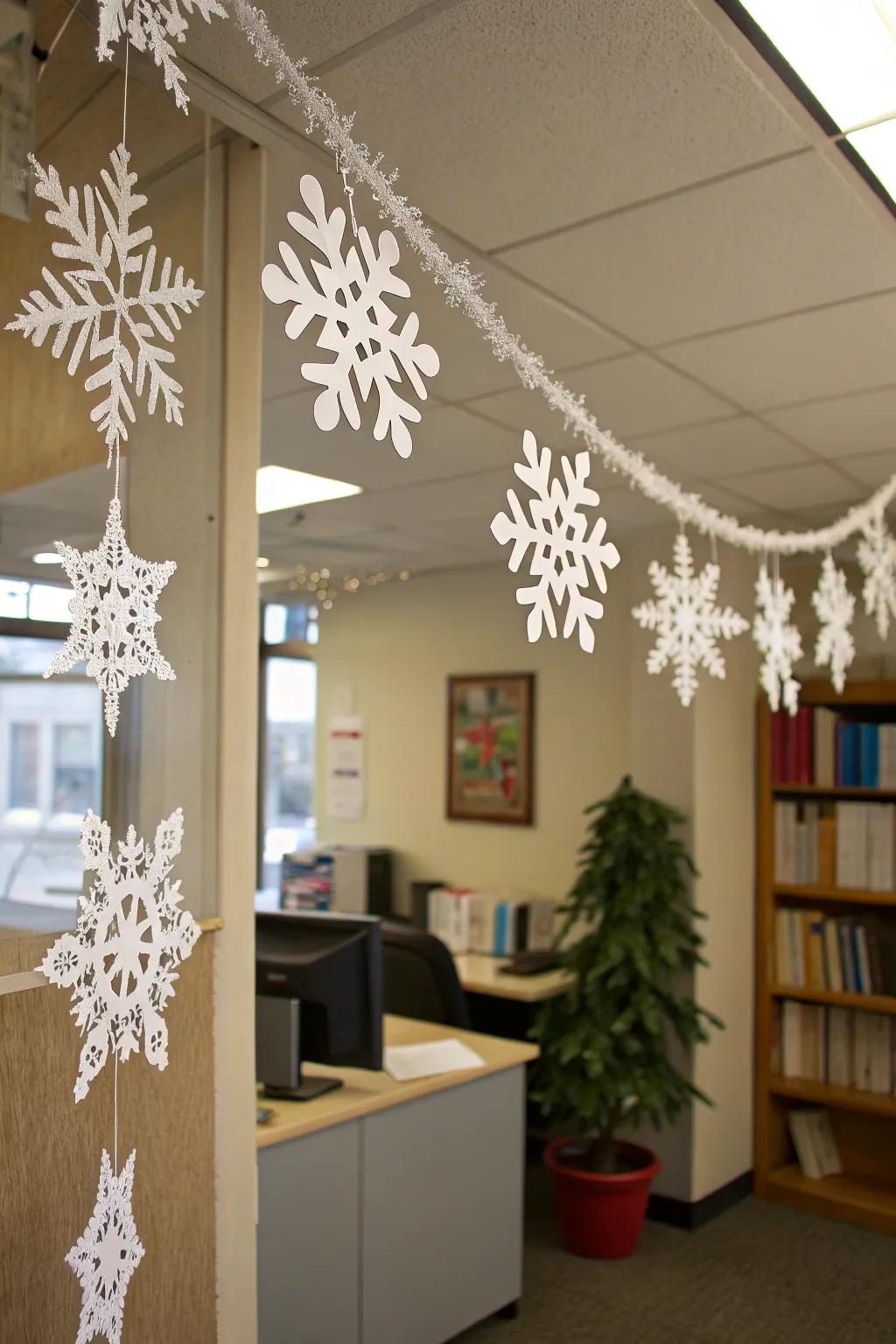 Delicate paper snowflake garland decorating an office space.