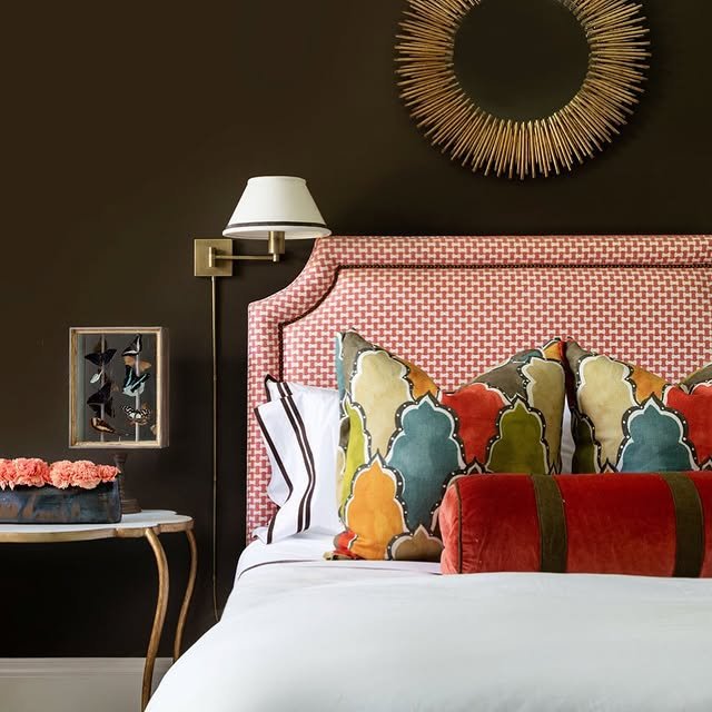 Elegant brown bedroom with colorful cushions