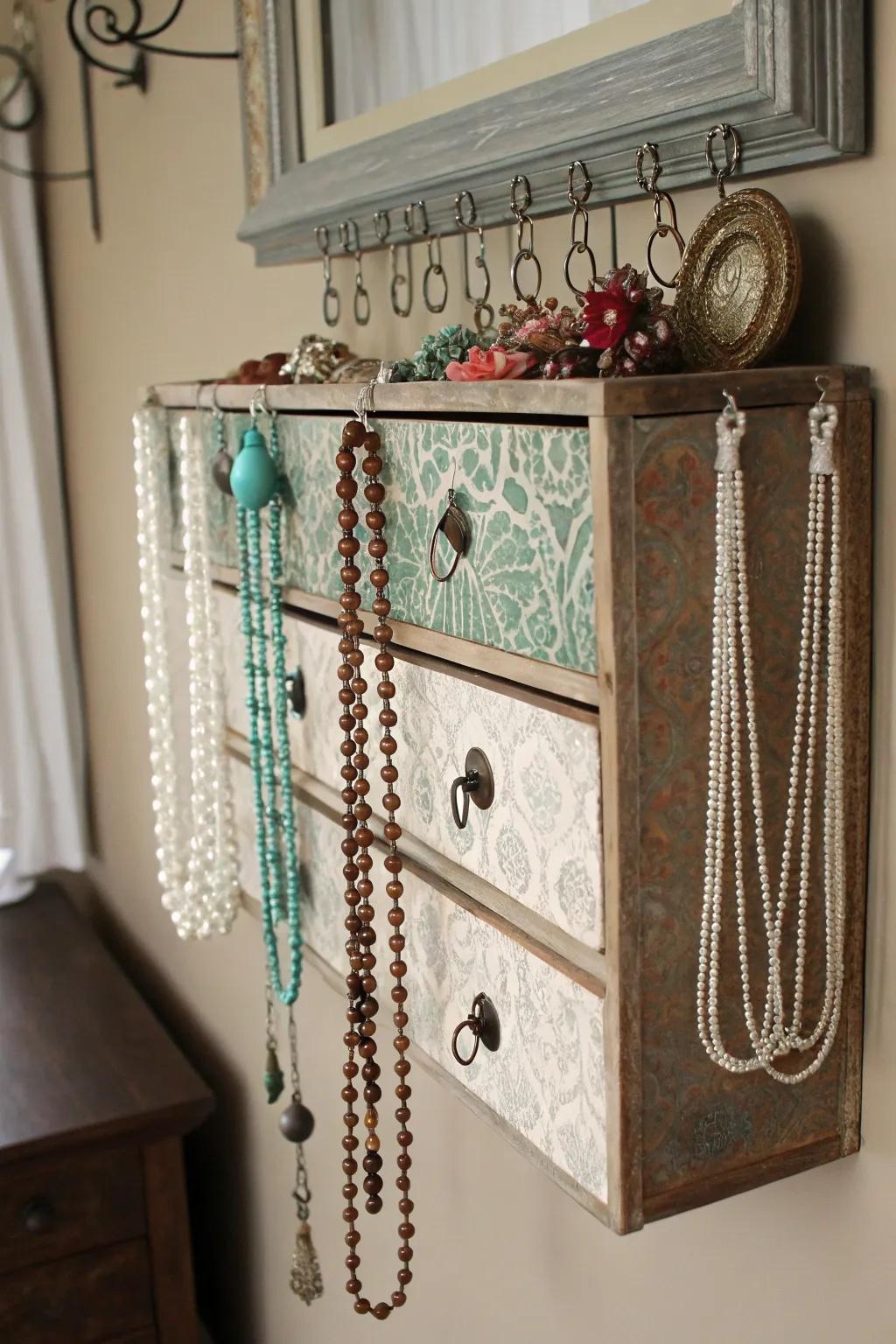 Vintage drawer repurposed as necklace holder
