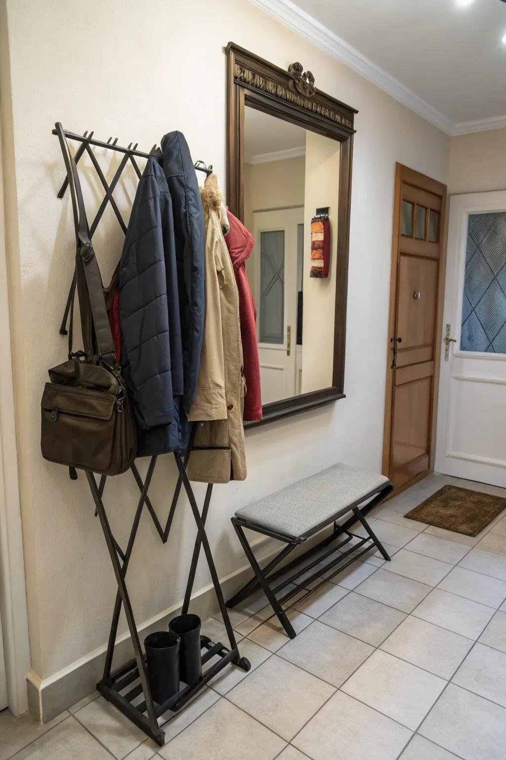 Foldable coat rack designed to save space in small entryways.