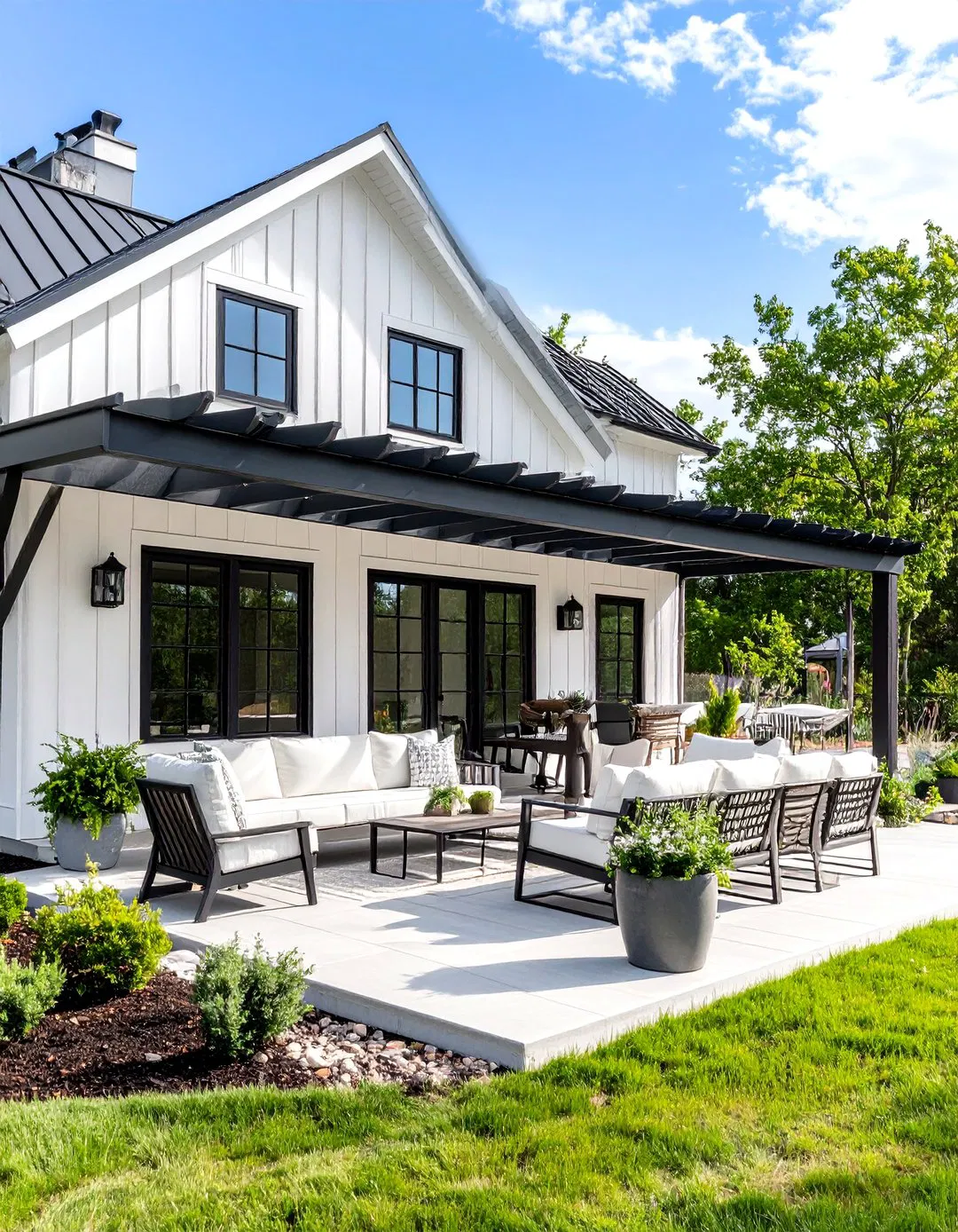 Outdoor Living Space Design - White Farmhouse with Black Windows