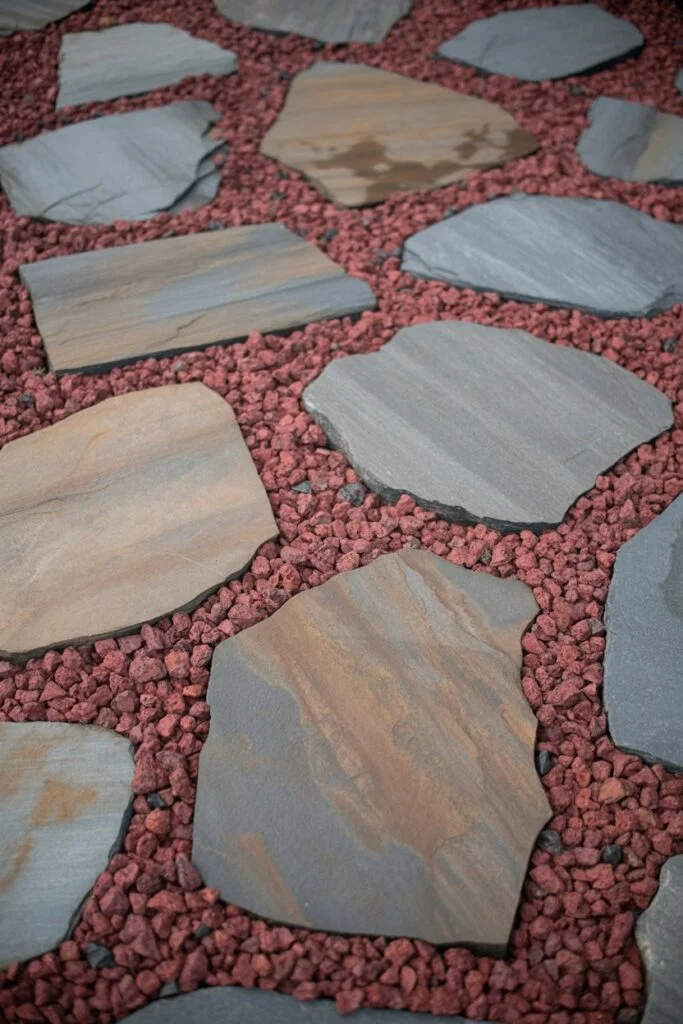Crushed red lava rock between flagstone pavers